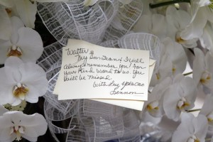 A card signed by Yoko Ono is attached to flowers sent to St. Bartholomew's Church on Park Ave. in Manhattan, the site of Walter Cronkite's funeral, Thursday, July 23, 2009 in New York. Cronkite died last Friday at his Manhattan home at age 92. (AP Photo/Kathy Willens)